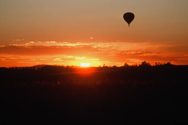 Hot air ballon rising above prairie