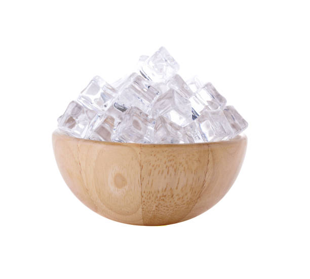 istock ice cubes in wooden bowl isolated on white background 2173436947