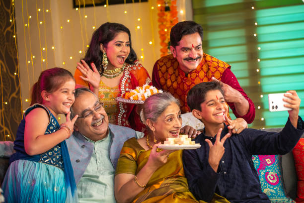 istock Happy multi-generation family taking selfie on sofa at home during Diwali 2173440230