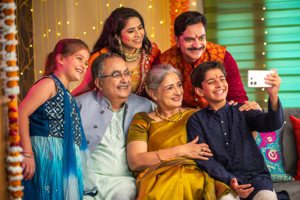 istock Happy multi-generation family taking selfie on sofa at home during Diwali 2173442154