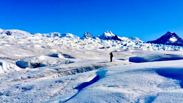 istock a person standing on a snowy mountain 2173447642
