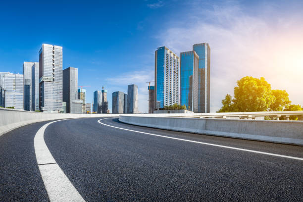 istock Asphalt highway road with modern city buildings scenery 2173454837