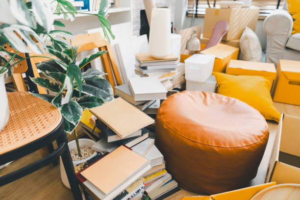 Messy room with scattered clothes on the armchair without people