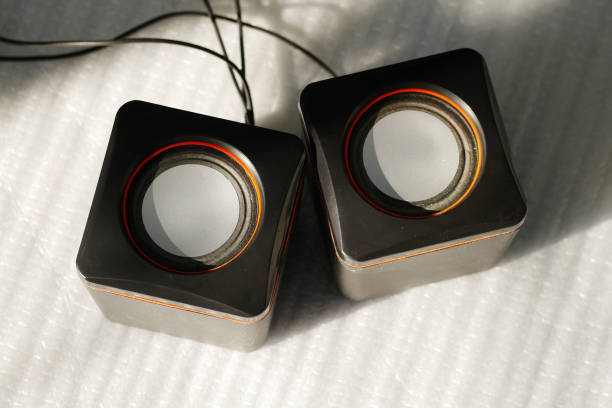 Front view of a 2-way Loudspeaker box system with a bass speaker and a tweeter, such a bass reflex opening in the front area, isolated on a white background