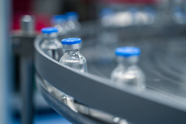 istock Bottles on a conveyor belt at a pharmaceutical bottle manufacturing plant 2173468176