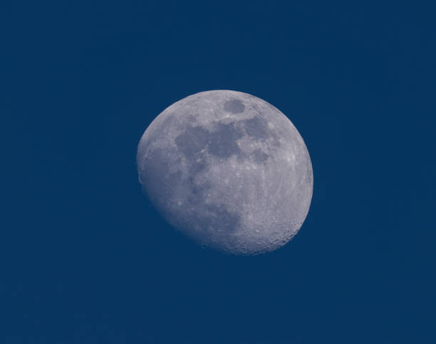 istock waxing gibbous moon on dark blue sky 2173469244