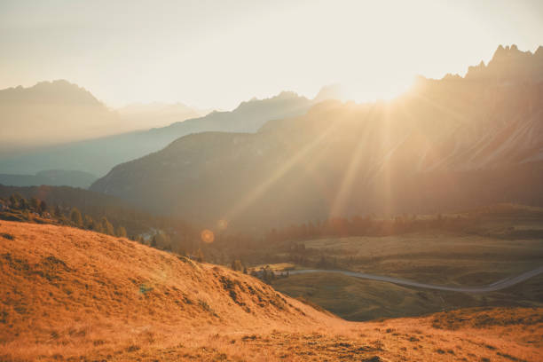 Morning light on mountains and meadow, Dolomites