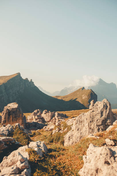 Morning light on mountains and meadow, Dolomites