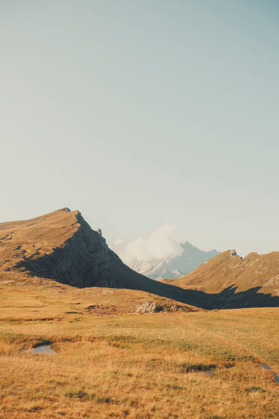 istock Morning light on mountains and meadow, Dolomites 2173471111