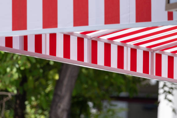 istock A red and white striped awning is over a tree 2173478743