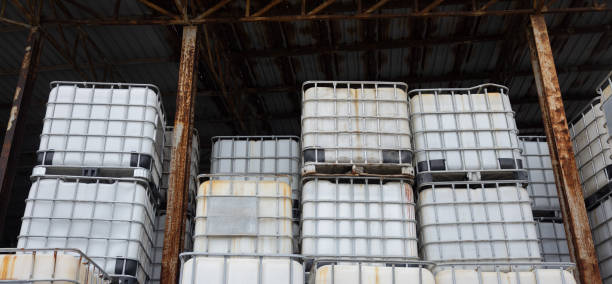 istock A stack of white plastic containers are piled on top of each other. Stacked IBC Containers. 2173478807