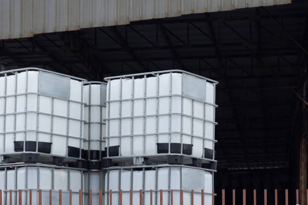 istock A stack of white plastic containers are piled on top of each other. Stacked IBC Containers. 2173478811