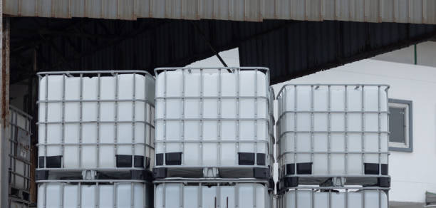 istock A stack of white plastic containers are piled on top of each other. Stacked IBC Containers. 2173478813