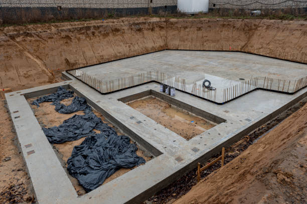 istock Concrete foundation of a detached house under construction in an excavation pit 2173481917