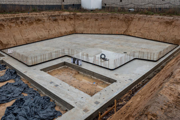 istock Concrete foundation of a detached house under construction in an excavation pit 2173481940