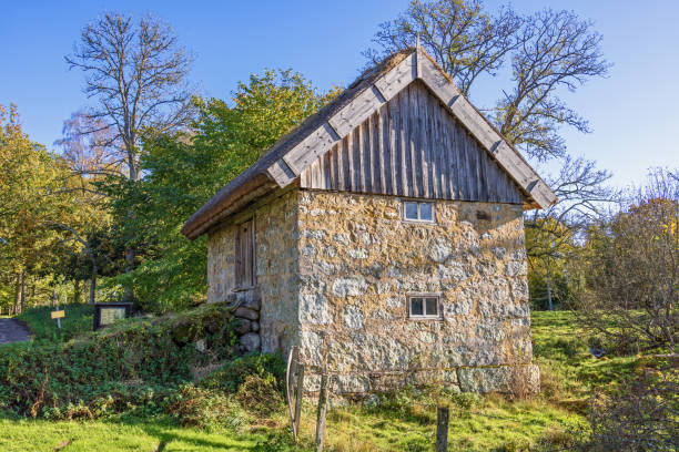 istock Old stone mill barn in the countryside by a meadow 2173482360
