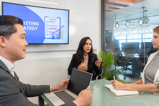 istock A diverse group of professionals gathering to discuss a marketing strategy and using laptops and other tech tools to facilitate their conversation navigating their way toward achieving their marketing objectives. 2173483213