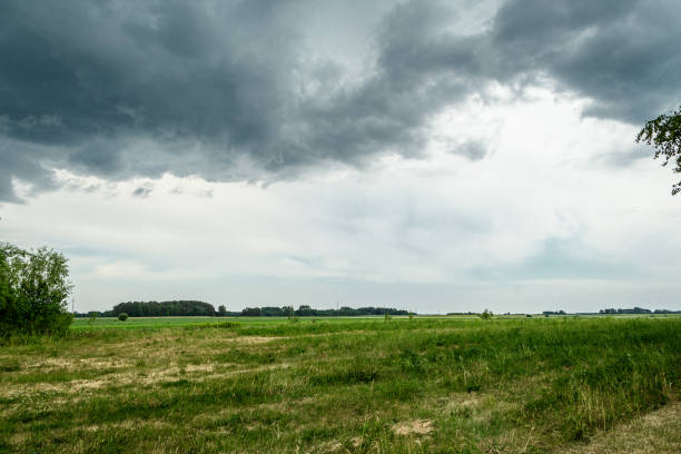 istock Dense storm cells, dark clouds over agricultural fields in the countryside 2173484490