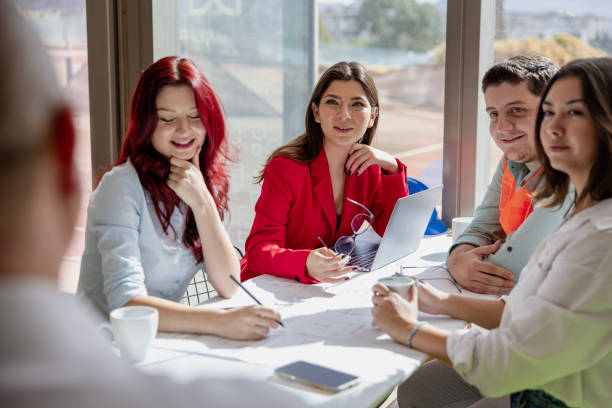 istock Manager and Creative Team Sitting and Meeting in a Modern and Bright Workspace Boardroom 2173491247