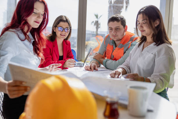 istock Manager and Creative Team Sitting and Meeting in a Modern and Bright Workspace Boardroom 2173491325