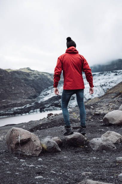 man standing on a glacier in iceland
