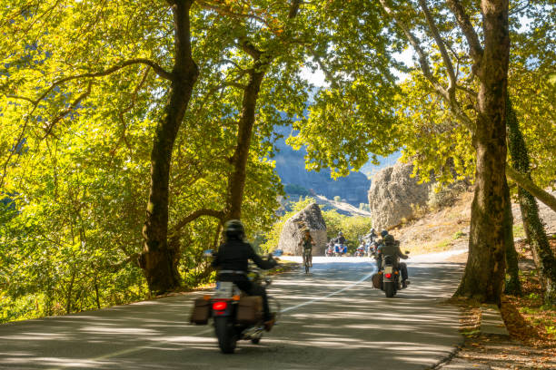 istock Motorcyclists and a Cyclist on a Summer Mountain Road 2173493447