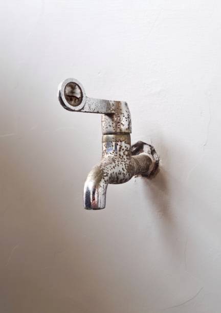 istock Rusty garden faucet on wall 2173497399
