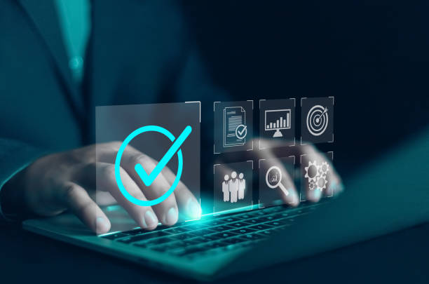 istock Businessman using digital document on laptop to approve business project proposal. Quality assurance concept, ISO certification and standards, satisfaction, service experience, show product and servic 2173497790