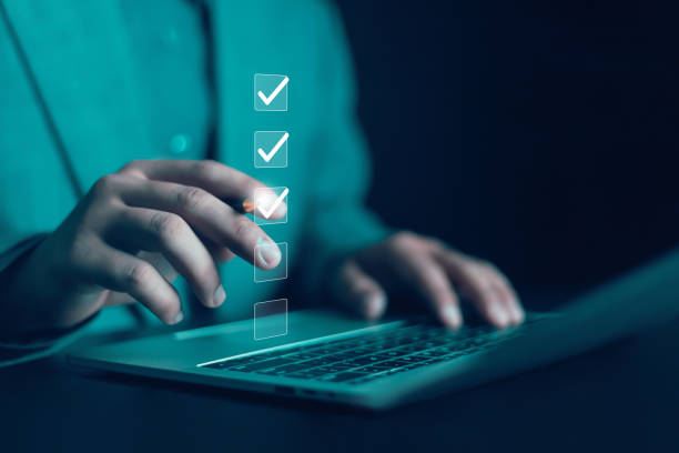 istock Business Performance Checklist Businessman Using Laptop Doing Survey Online Checklist Filling Out Survey Checklist Digital Form Doing Assessment Questionnaire Assessment Online Survey 2173497791