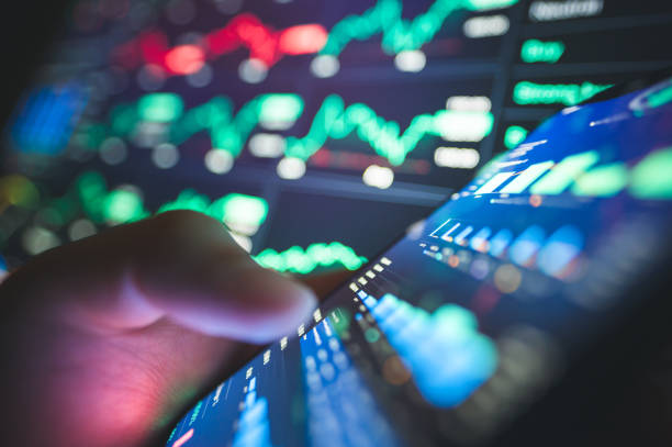istock Investor analyzing stock performance using charts and graphs. Ideal for illustrating thorough investment analysis and market research 2025 2173500698
