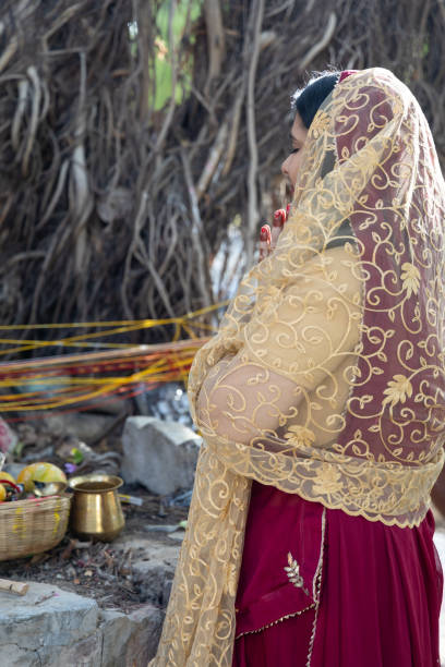 istock devotee worshiping the holy banyan tree with offerings at day 2173503048