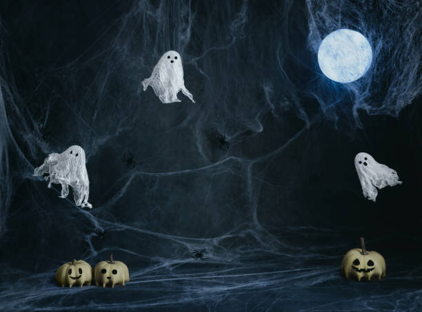 istock Halloween template with ghosts, moon, pumpkins on dark blue background with cobwebs. Halloween night background with copy space. 2173505857