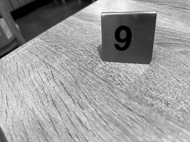 istock Minimalist Number 9 on Wooden Table 2173506674