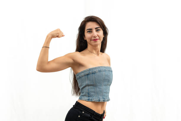 Slim woman shows off her arm muscles