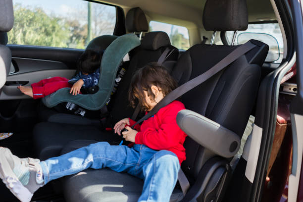 istock kid sleeping in the car 2173507703