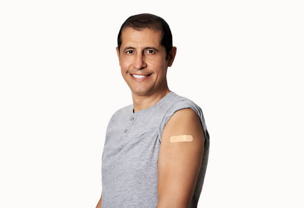 istock happy man with band aid on his arm 2173508460