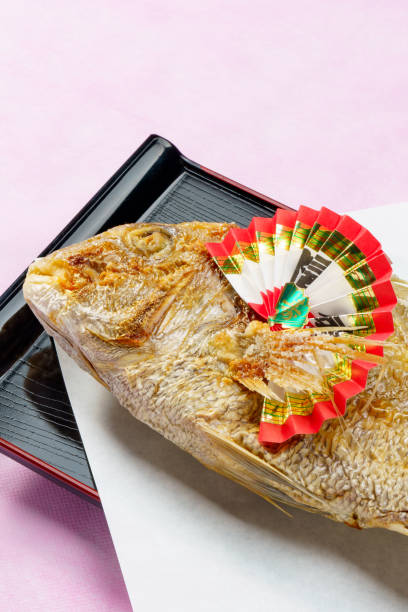 Whole grilled sea bream with salt