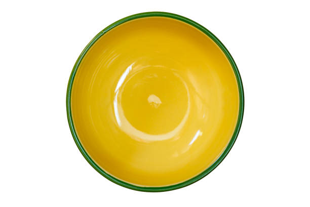 istock Top view of empty single yellow ceramic bowl with green edge. 2173515144
