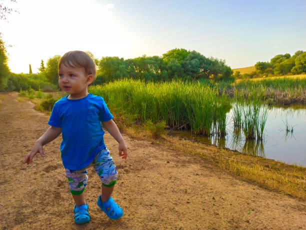 a baby who plays and has fun in nature