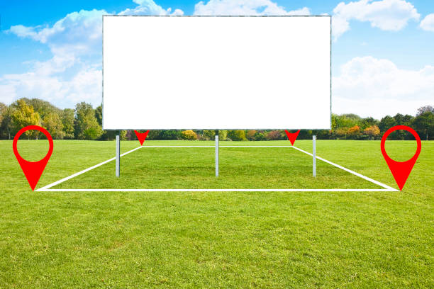 istock LAND PLOT MANAGEMENT WITH BLANK ADVERTISING BILLBOARD - Real Estate concept on a vacant land available for building construction in a residential area for sale, rent, buy or investment 2173520695