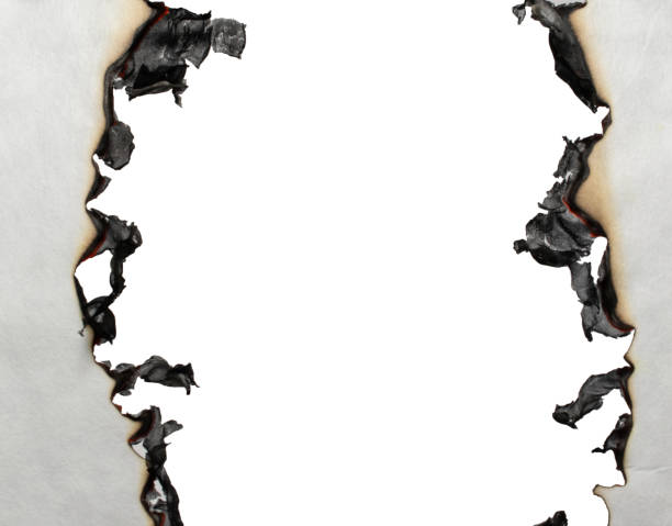 istock burning paper, glowing edge of paper 2173521181