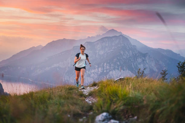 istock Young Woman Running in high Mountain during Dusk 2173524451