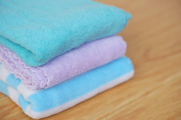 Stack of folded soft towels. Concept, clothes in daily life using. Towel for bathing, showering or spa massage.