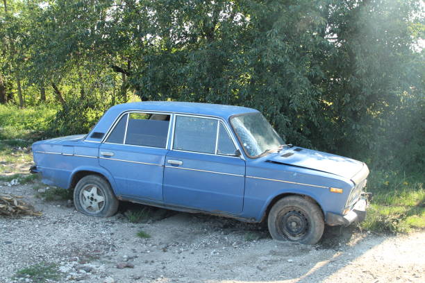 istock A blue car parked on a dirt road 2173534794