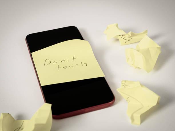 istock Smartphone with a “Do Not Touch” sticker: a symbol of a break from digital devices, reminding you of the importance of unplugging and taking a break 2173537148