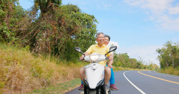 istock elder couple ride motorcycle happy 2173537578