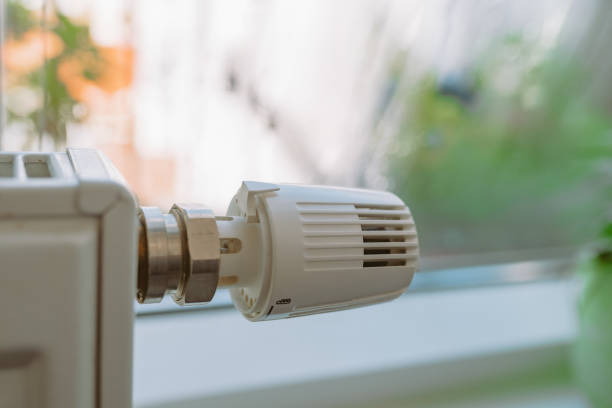 istock close-up of radiator regulator against blurred window 2173553063