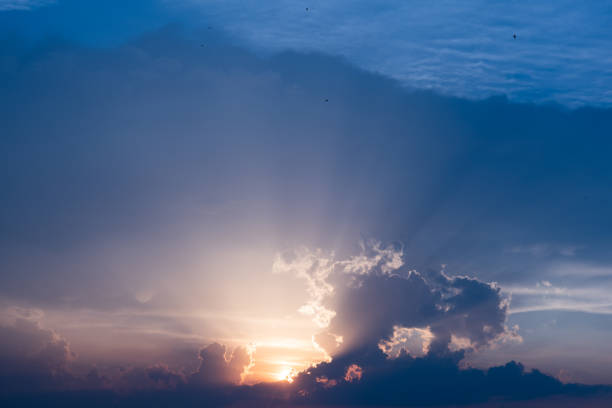 Sunset sky dramatic sunset clouds and sunset sunrays. Beautiful colorful dramatic sky with clouds at sunset or sunrise. Sun rays. Skyscape nature composition. Natural sky background
