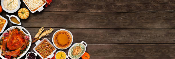 istock Traditional Thanksgiving turkey dinner corner border on a rustic dark wood banner background 2173558257