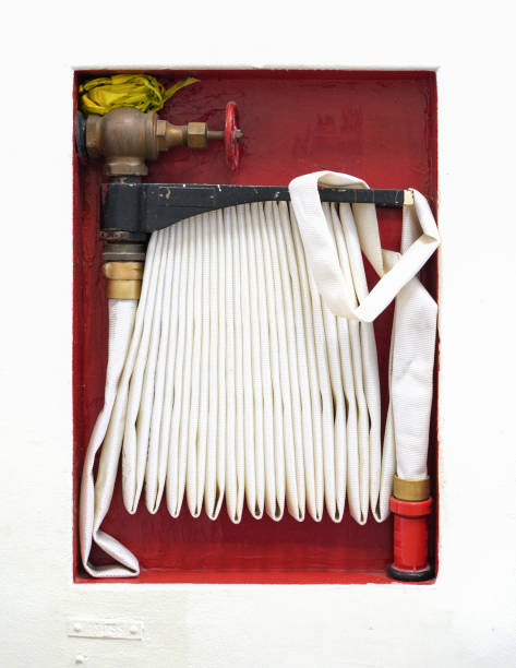 close up on fire extinguisher and fire hose reel